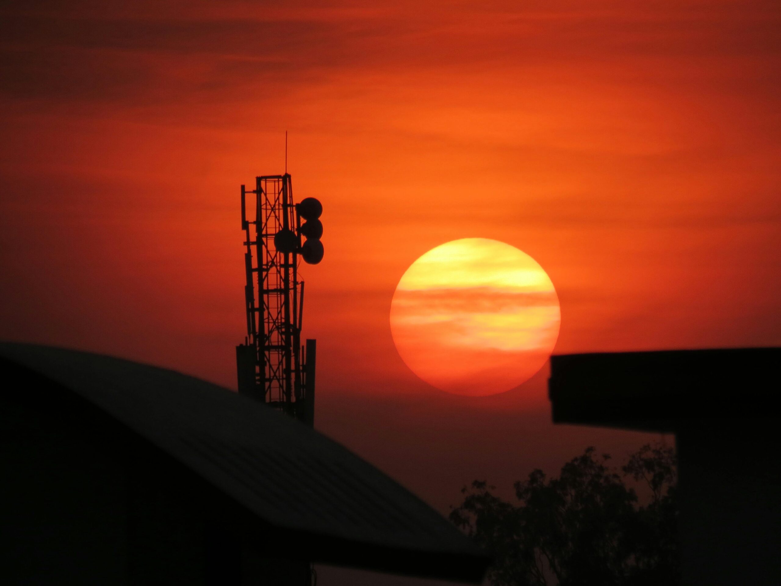 mobile tower image during sunset